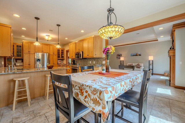 303 Rimrock Rd, Wausau, WI 54401 - dining space with recessed lighting and light stone finish flooring