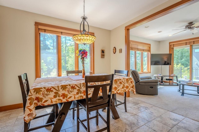303 Rimrock Rd, Wausau, WI 54401 - dining area featuring ceiling fan and stone tile floors