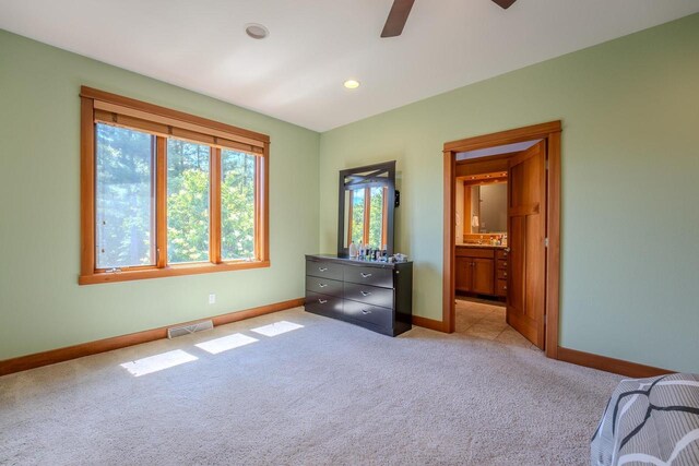 303 Rimrock Rd, Wausau, WI 54401 - bedroom with light colored carpet, recessed lighting, ceiling fan, and ensuite bathroom