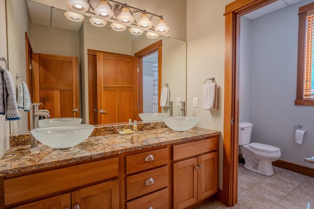 303 Rimrock Rd, Wausau, WI 54401 - full bath with double vanity and tile patterned floors