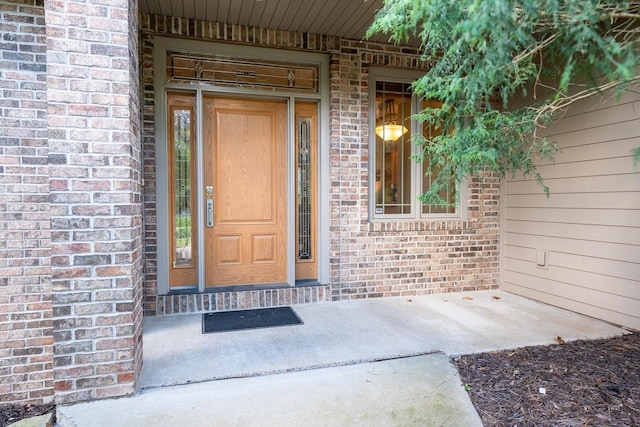 303 Rimrock Rd, Wausau, WI 54401 - doorway to property featuring brick siding