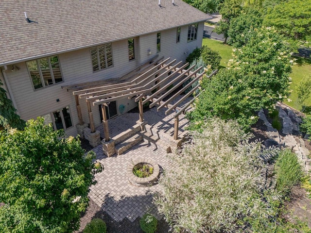 303 Rimrock Rd, Wausau, WI 54401 - back of property featuring a patio, roof with shingles, and a pergola