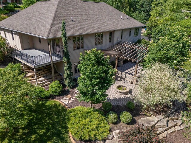 303 Rimrock Rd, Wausau, WI 54401 - rear view of property featuring a pergola, a shingled roof, stairs, and a deck