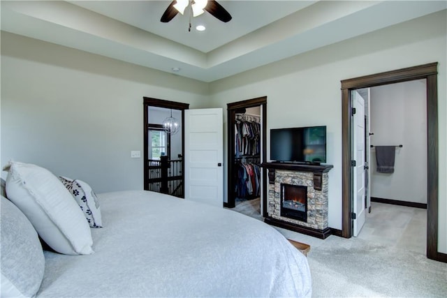 2247 105th St, Eau Claire, WI 54703 - carpeted bedroom featuring a fireplace, a walk in closet, recessed lighting, a ceiling fan, and a closet