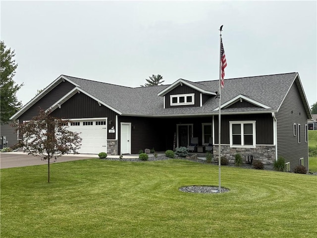 2247 105th St, Eau Claire, WI 54703 - craftsman-style house with stone siding, roof with shingles, a front yard, and an attached garage