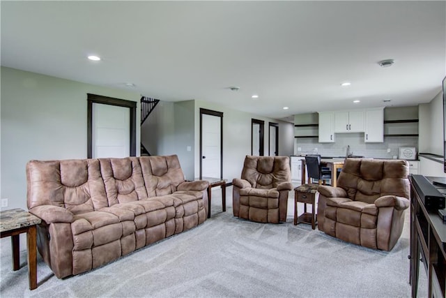 2247 105th St, Eau Claire, WI 54703 - living area with light colored carpet, recessed lighting, and stairway