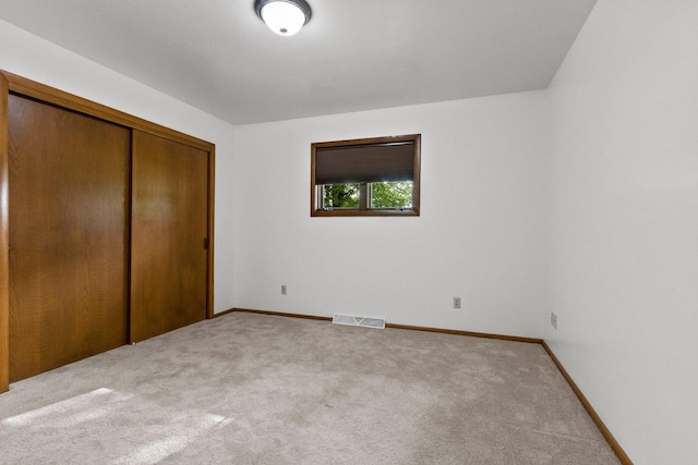 2929 Brunner Rd, Manitowoc, WI 54220 - unfurnished bedroom with light colored carpet and a closet