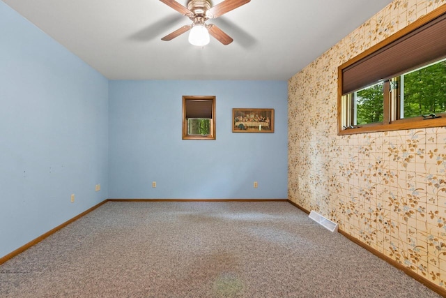 2929 Brunner Rd, Manitowoc, WI 54220 - carpeted empty room featuring a ceiling fan and baseboards