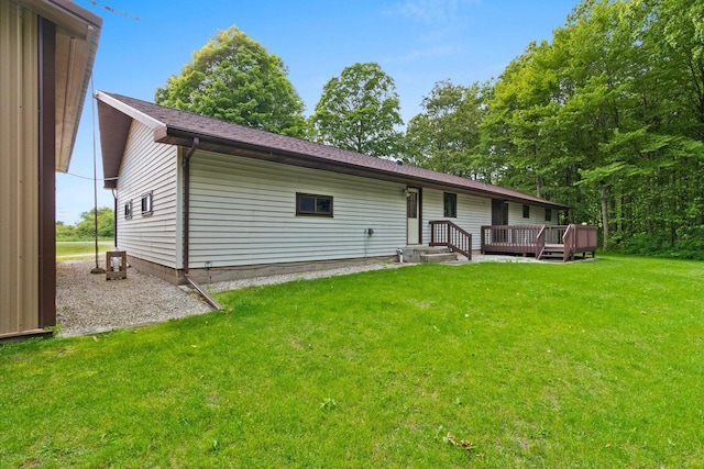 2929 Brunner Rd, Manitowoc, WI 54220 - rear view of property featuring a yard and a wooden deck