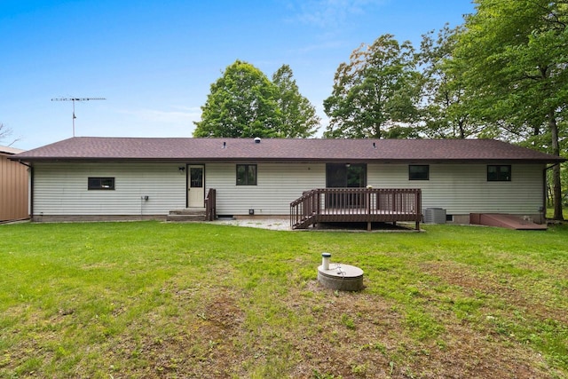 2929 Brunner Rd, Manitowoc, WI 54220 - rear view of house with a deck and a lawn