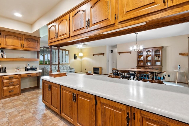 2929 Brunner Rd, Manitowoc, WI 54220 - kitchen with brown cabinets, light countertops, open shelves, and pendant lighting