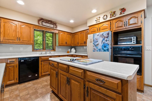 2929 Brunner Rd, Manitowoc, WI 54220 - kitchen with black appliances, brown cabinetry, light countertops, a kitchen island, and recessed lighting
