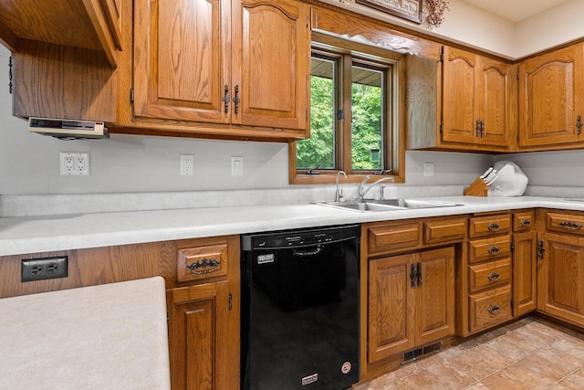 2929 Brunner Rd, Manitowoc, WI 54220 - kitchen featuring dishwasher, brown cabinetry, and light countertops