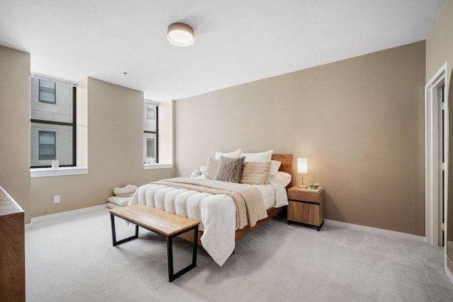 234 N Broadway Unit 402, Milwaukee, WI 53202 - bedroom with light carpet and baseboards