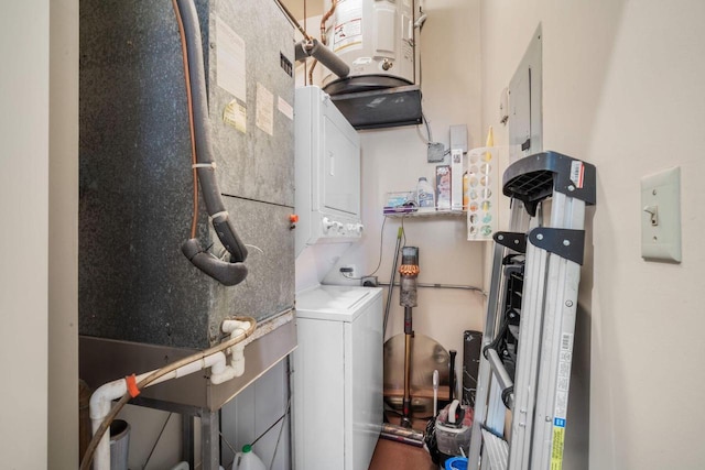 234 N Broadway Unit 402, Milwaukee, WI 53202 - laundry area with stacked washer / drying machine and heating unit