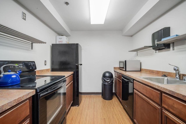 234 N Broadway Unit 402, Milwaukee, WI 53202 - kitchen with black appliances, open shelves, light wood-style floors, light countertops, and brown cabinetry