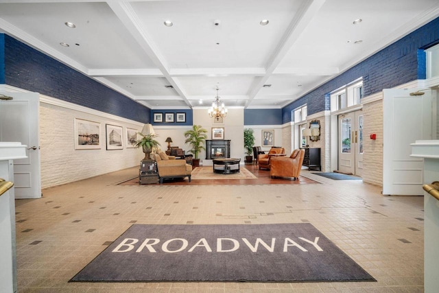 234 N Broadway Unit 402, Milwaukee, WI 53202 - lobby featuring beam ceiling, brick wall, coffered ceiling, and recessed lighting