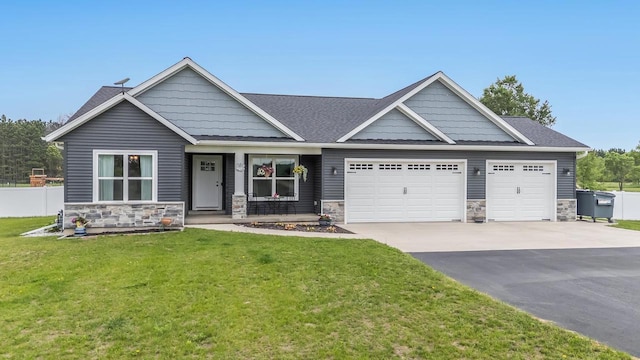 N3366 Flynn Dr, Montello, WI 53949 - craftsman-style home with stone siding, a garage, and concrete driveway