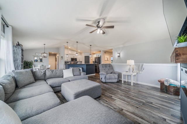 N3366 Flynn Dr, Montello, WI 53949 - living area featuring lofted ceiling, dark wood-type flooring, and a ceiling fan
