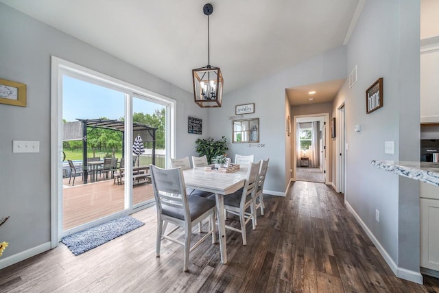 N3366 Flynn Dr, Montello, WI 53949 - dining area with healthy amount of natural light, dark wood-type flooring, and a chandelier