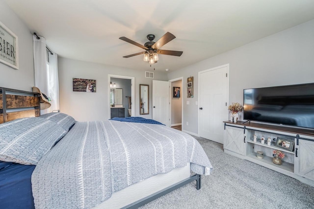 N3366 Flynn Dr, Montello, WI 53949 - bedroom with carpet flooring, a ceiling fan, and connected bathroom
