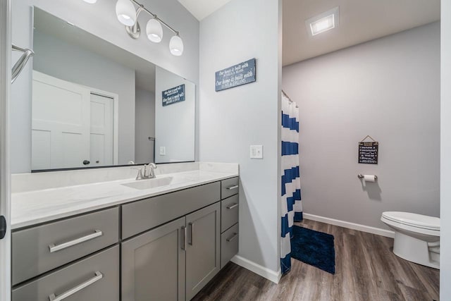 N3366 Flynn Dr, Montello, WI 53949 - bathroom with wood finished floors, vanity, and a shower with curtain