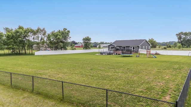 N3366 Flynn Dr, Montello, WI 53949 - fenced backyard featuring a deck and a playground