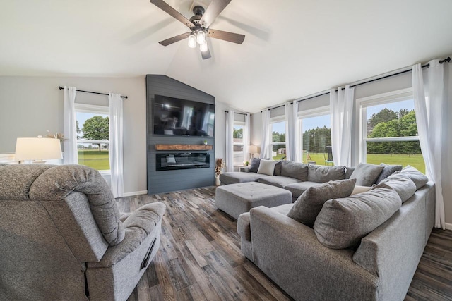N3366 Flynn Dr, Montello, WI 53949 - living room featuring a large fireplace, vaulted ceiling, dark wood finished floors, and a ceiling fan