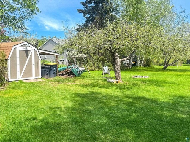 303 E 5th St, Washburn, WI 54891 - view of green lawn featuring a storage unit