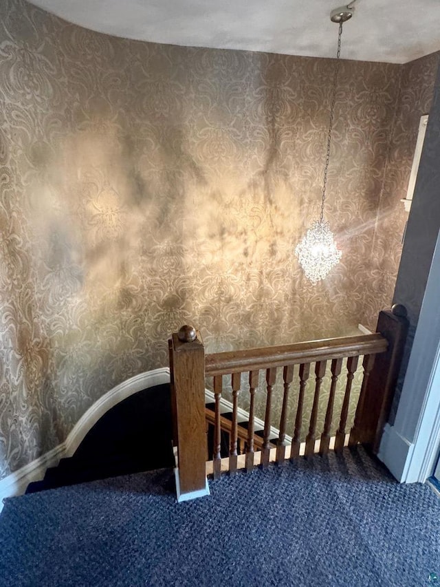 303 E 5th St, Washburn, WI 54891 - stairway featuring carpet and a chandelier