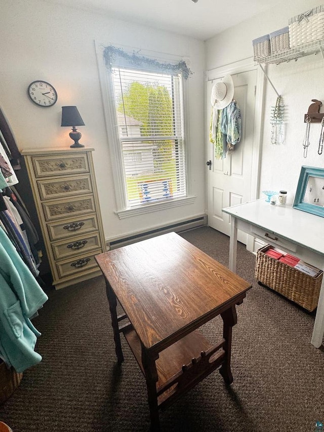 303 E 5th St, Washburn, WI 54891 - dining room featuring a baseboard radiator and dark carpet