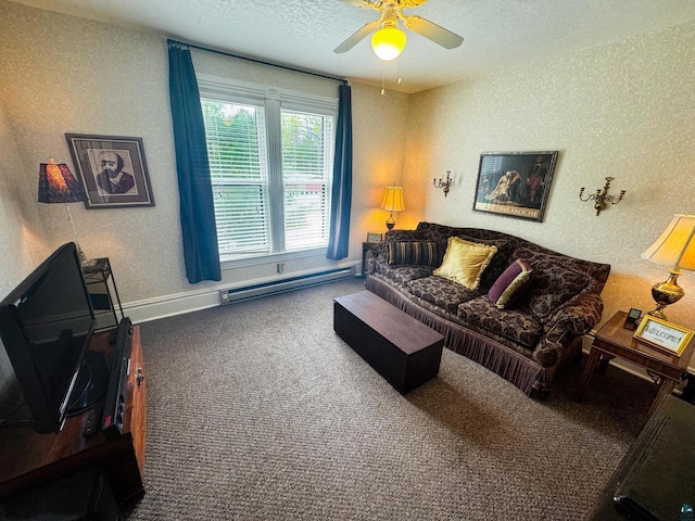 303 E 5th St, Washburn, WI 54891 - carpeted living room featuring baseboard heating, a ceiling fan, a textured ceiling, and a textured wall