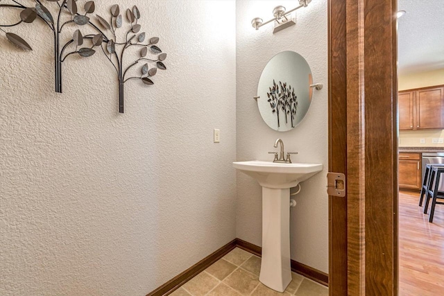 739 Pinehurst Dr, Mukwonago, WI 53149 - bathroom with baseboards and a sink