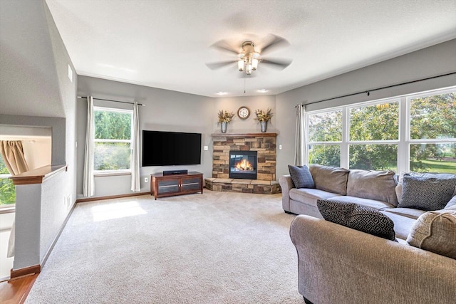 739 Pinehurst Dr, Mukwonago, WI 53149 - carpeted living room with ceiling fan and a stone fireplace
