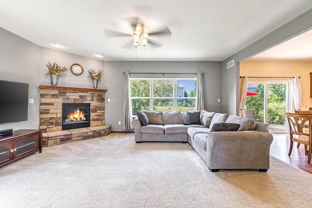 739 Pinehurst Dr, Mukwonago, WI 53149 - carpeted living room with a ceiling fan and a fireplace