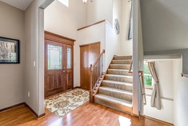 739 Pinehurst Dr, Mukwonago, WI 53149 - entrance foyer with wood finished floors, stairway, and a towering ceiling