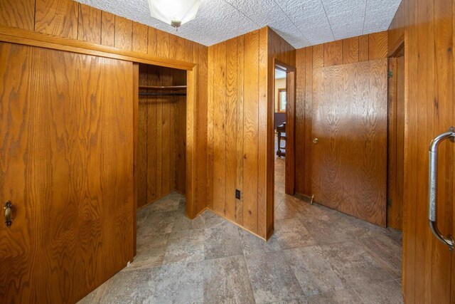 4080 Camp Bryn Afon Rd, Rhinelander, WI 54501 - unfurnished bedroom featuring wood walls and a closet