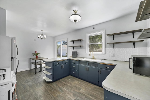 1007 14th Ave, Green Bay, WI 54304 - kitchen featuring open shelves, white range with gas stovetop, and light countertops