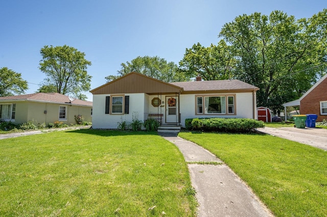 1007 14th Ave, Green Bay, WI 54304 - view of front of property with a front yard and stucco siding
