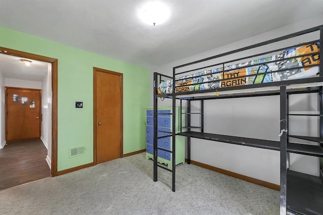 1007 14th Ave, Green Bay, WI 54304 - unfurnished bedroom with baseboards and carpet floors