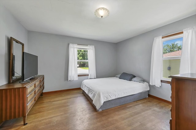 1007 14th Ave, Green Bay, WI 54304 - bedroom featuring light wood-style flooring and baseboards