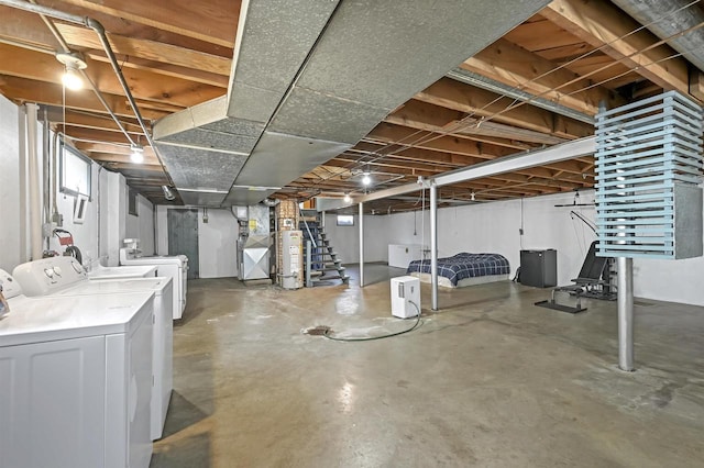1007 14th Ave, Green Bay, WI 54304 - unfinished basement featuring washer and clothes dryer, gas water heater, and stairs