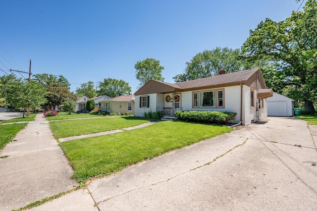 1007 14th Ave, Green Bay, WI 54304 - ranch-style house featuring a garage, a front lawn, stucco siding, an outbuilding, and roof with shingles