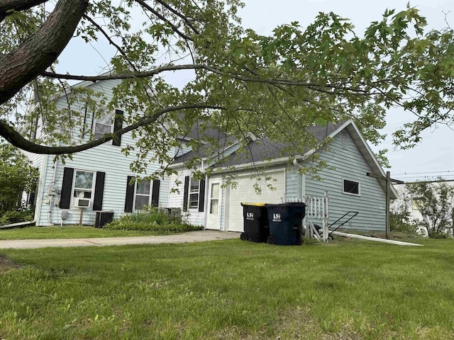404 Prairie St, Mauston, WI 53948 - view of front of house with an attached garage, a front yard, and driveway