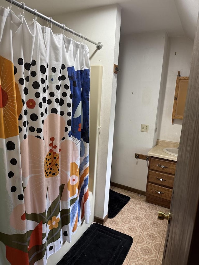 404 Prairie St, Mauston, WI 53948 - bathroom featuring vanity and curtained shower
