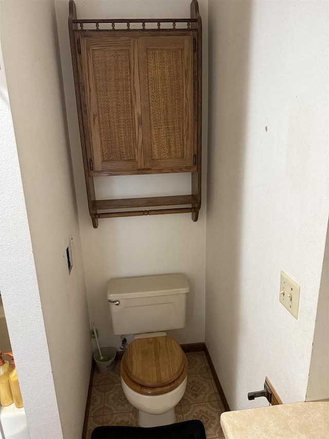404 Prairie St, Mauston, WI 53948 - bathroom featuring toilet and baseboards
