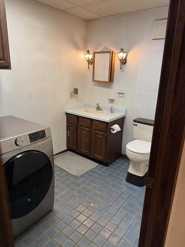 404 Prairie St, Mauston, WI 53948 - bathroom featuring washer / dryer and vanity