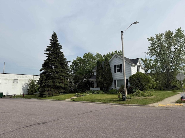 404 Prairie St, Mauston, WI 53948 - view of asphalt road with curbs, street lights, and traffic signs