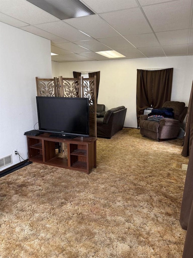 404 Prairie St, Mauston, WI 53948 - carpeted living area featuring a paneled ceiling
