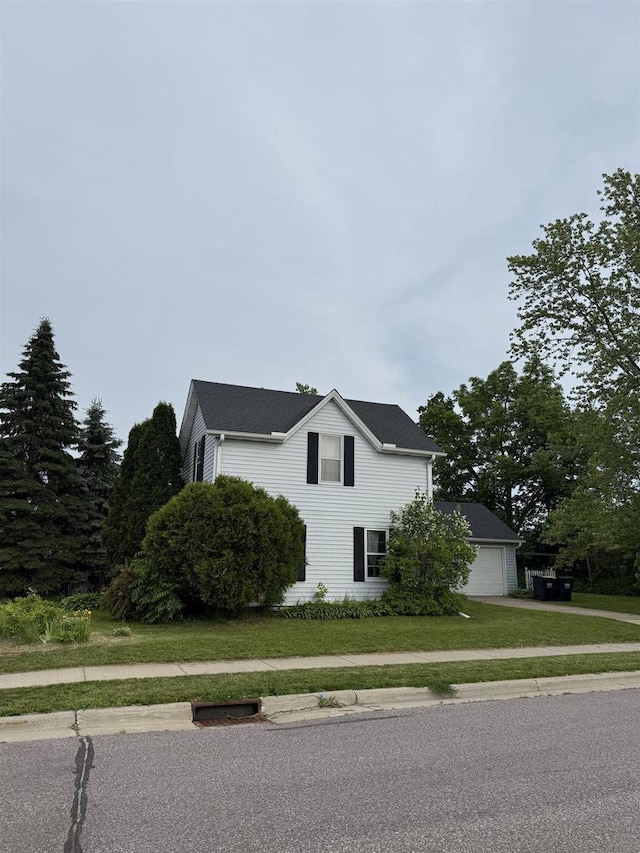 404 Prairie St, Mauston, WI 53948 - view of side of property featuring a lawn and driveway